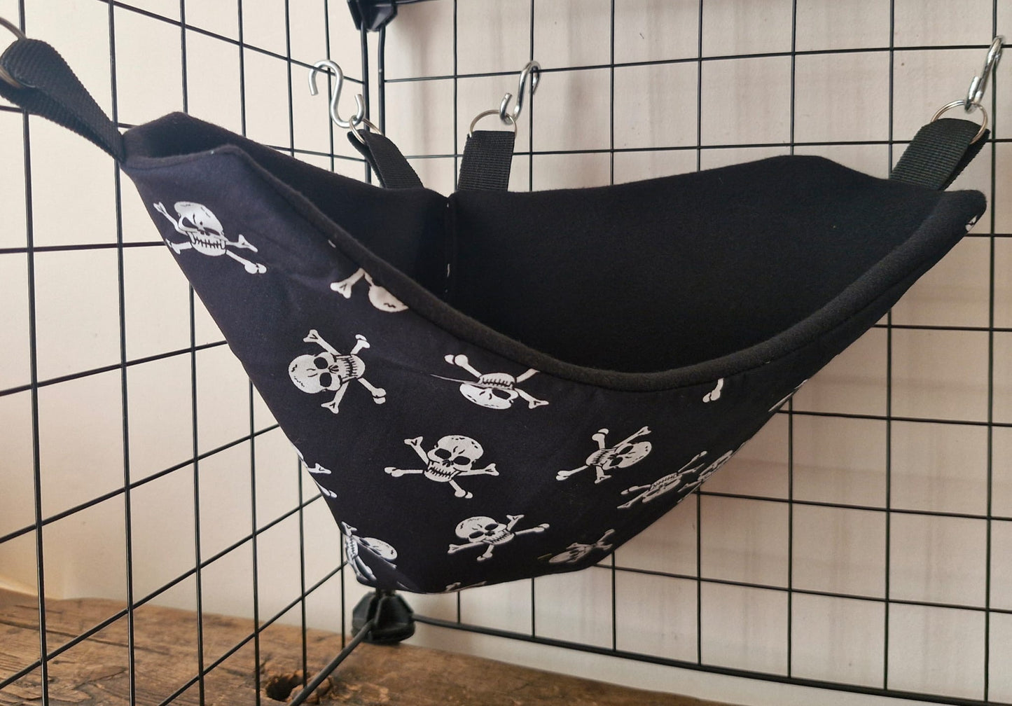 Mischief Made fleece lined corner pocket. Skulls print with black fleece lining